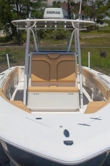  Yacht Photos Pics 2012 Contender 39 LS boat with Simrad electronics, featuring tan seating and a sleek design.