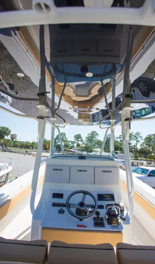  Yacht Photos Pics 2012 Contender 39 LS boat cockpit with steering wheel and controls.