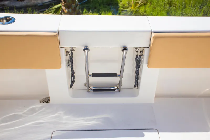  Yacht Photos Pics Contender 39 LS 2012 boat ladder with cushioned seating and stainless steel details.