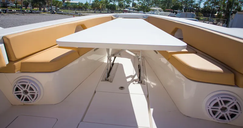  Yacht Photos Pics Contender 39 LS 2012 boat interior with tan seating and white table.