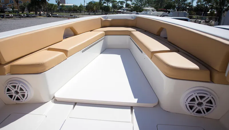  Yacht Photos Pics Contender 39 LS 2012 boat interior with tan cushioned seating and white speakers.