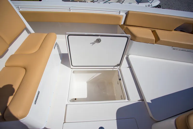 Yacht Photos Pics Contender 39 LS 2012 boat interior with open storage compartment and tan seating.