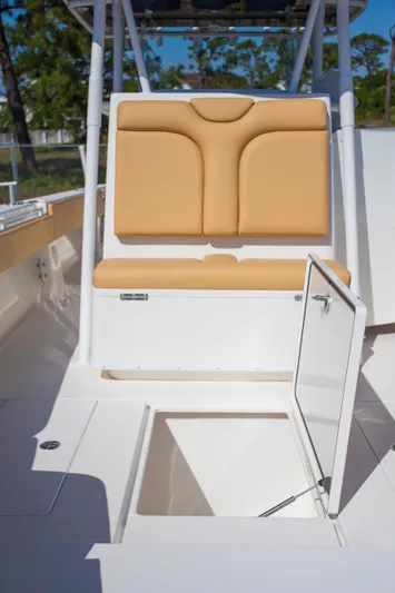  Yacht Photos Pics Contender 39 LS 2012 boat interior with tan seating and open storage compartment.