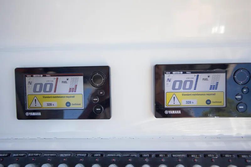  Yacht Photos Pics Yamaha engine displays on a 2012 Contender 39 LS boat, showing maintenance alerts.