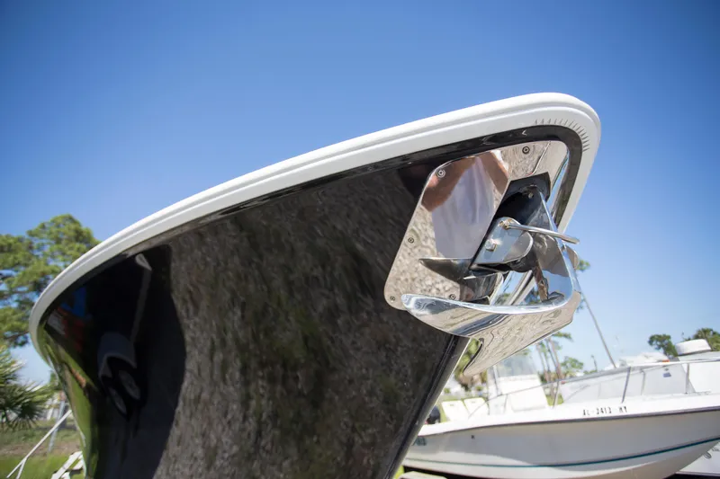  Yacht Photos Pics Bow of 2012 Contender 39 LS boat with anchor, under clear blue sky.