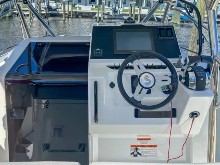  Yacht Photos Pics 2024 Beneteau Flyer 9 SPACEdeck helm with modern controls and navigation display.