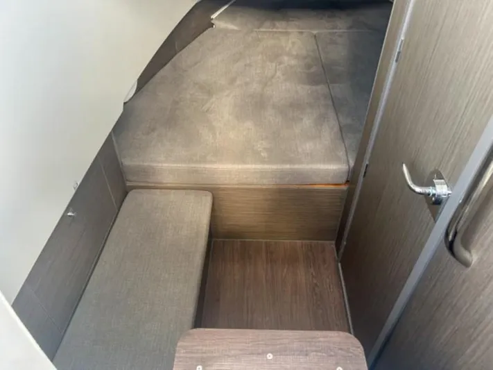  Yacht Photos Pics 2024 Beneteau Flyer 9 SPACEdeck cabin interior with wooden flooring and seating area.