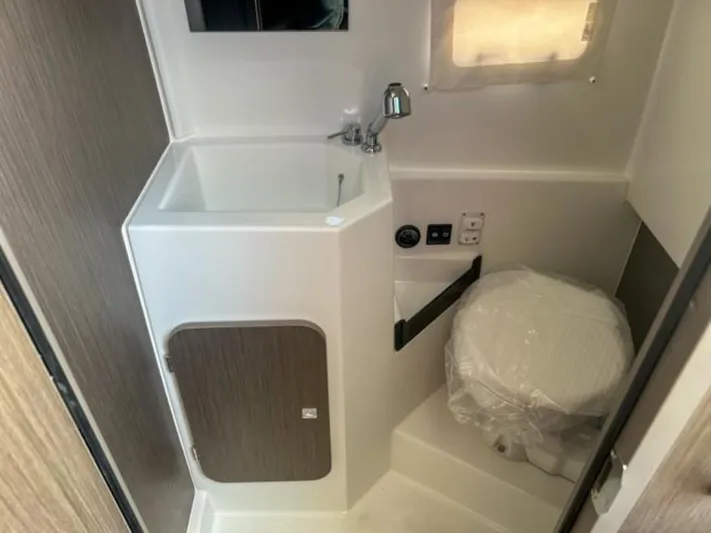  Yacht Photos Pics 2024 Beneteau Flyer 9 SPACEdeck bathroom with sink and toilet.