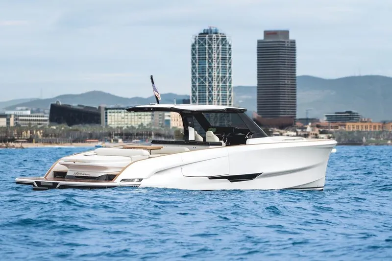  Yacht Photos Pics 2026 Solaris Power 44 Sport Turismo yacht cruising near city skyline.