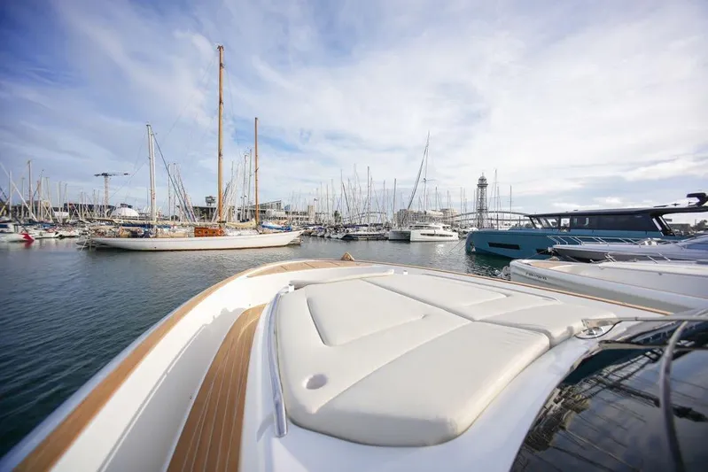  Yacht Photos Pics 2026 Solaris Power 44 Sport Turismo yacht docked in a bustling marina.