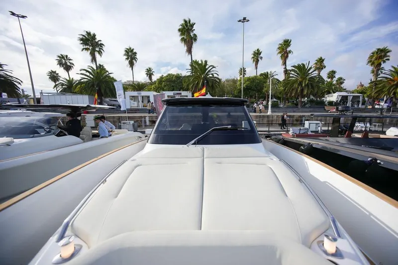  Yacht Photos Pics 2026 Solaris Power 44 Sport Turismo yacht at marina with palm trees in background.