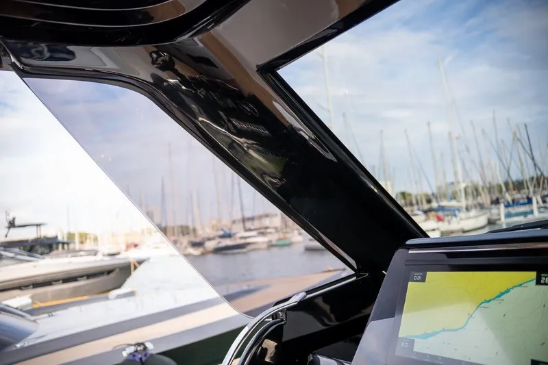  Yacht Photos Pics 2026 Solaris Power 44 Sport Turismo yacht interior with navigation display, marina view.