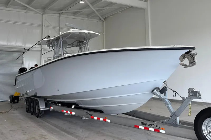  Yacht Photos Pics 2021 SeaVee 390Z boat on trailer in a spacious indoor facility.
