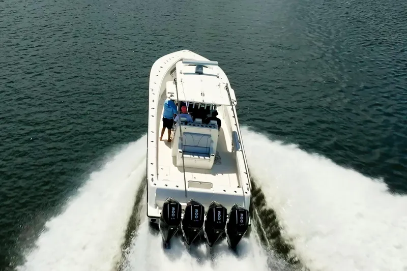  Yacht Photos Pics 2021 SeaVee 390Z boat cruising on open water with four powerful engines.
