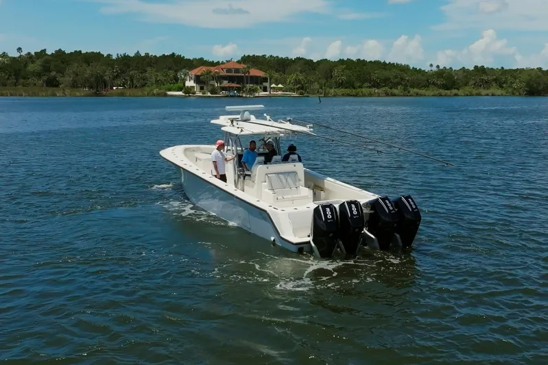  Yacht Photos Pics 2021 SeaVee 390Z boat cruising on a lake with multiple outboard engines.