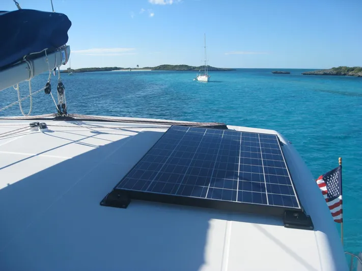 Rollercoaster Yacht Photos Pics Lagoon 420 catamaran with solar panel on blue water, year 2007.