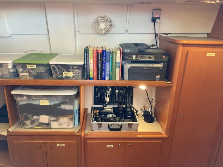 Rollercoaster Yacht Photos Pics Lagoon 420 yacht interior with books and electronics.