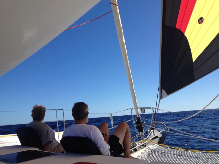 Rollercoaster Yacht Photos Pics Two people relaxing on a 2007 Lagoon 420 yacht at sea.