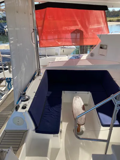 Rollercoaster Yacht Photos Pics Interior of a 2007 Lagoon 420 yacht with blue seating cushions.