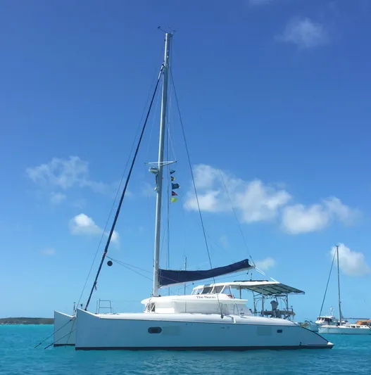 Rollercoaster Yacht Photos Pics 2007 Lagoon 420 catamaran on calm waters under a blue sky.