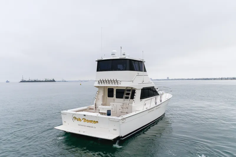 Pole Dancer Yacht Photos Pics 2005 Mediterranean 54 yacht cruising in open water, overcast sky.