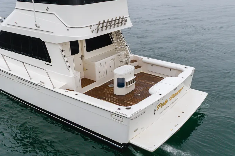 Pole Dancer Yacht Photos Pics 2005 Mediterranean 54 yacht with spacious deck on calm water.