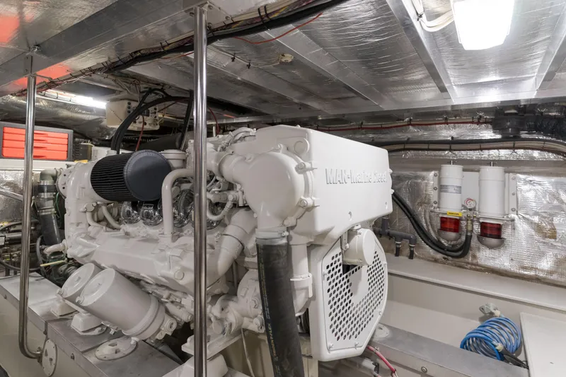 Pole Dancer Yacht Photos Pics Engine room of a 2005 Mediterranean 54 yacht, featuring a MAN marine engine.
