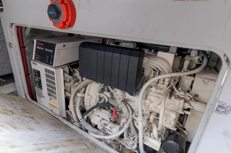 Pole Dancer Yacht Photos Pics Engine compartment of a 2005 Mediterranean 54 yacht with Onan Marine Genset.