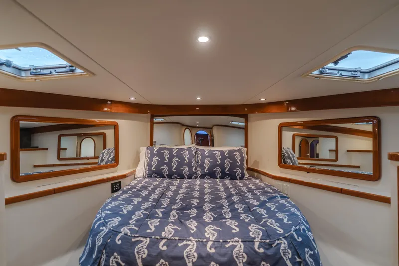 Pole Dancer Yacht Photos Pics Luxurious cabin interior of 2005 Mediterranean 54 yacht with seahorse-themed bedding.