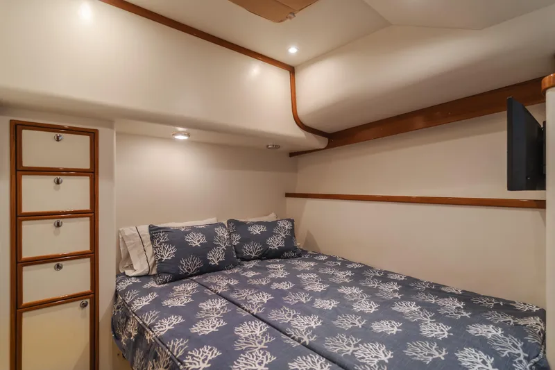 Pole Dancer Yacht Photos Pics Luxurious cabin interior of 2005 Mediterranean 54 yacht with cozy bedding.