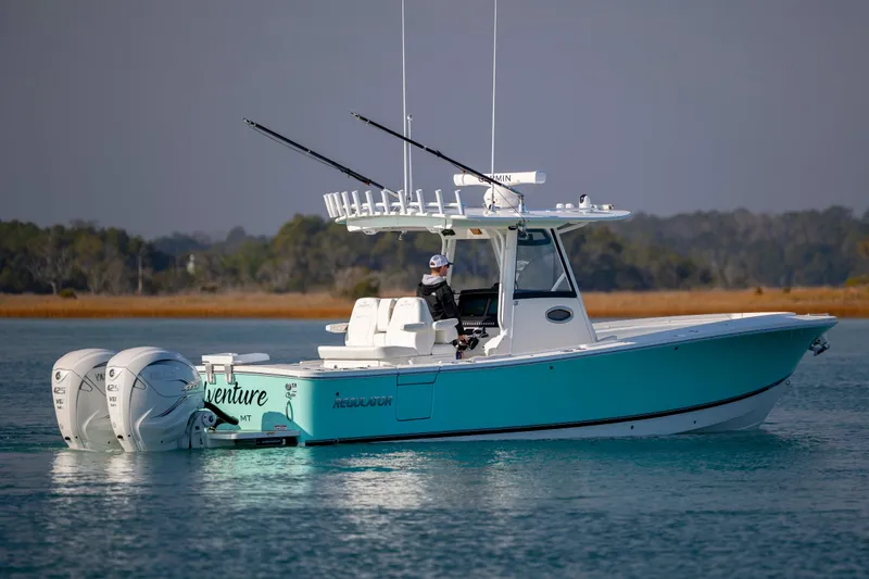  Yacht Photos Pics 2022 Regulator 31 boat with dual Yamaha engines on calm water.