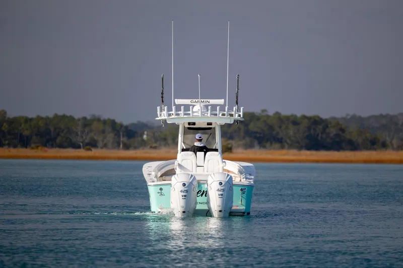  Yacht Photos Pics 2022 Regulator 31 boat with twin Yamaha 425 V8 engines on calm water.