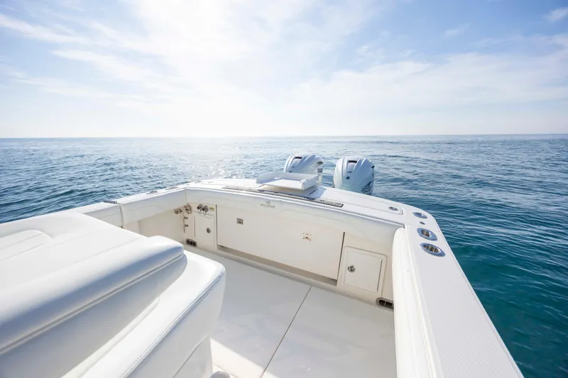  Yacht Photos Pics 2022 Regulator 31 boat on open sea, featuring dual engines and sleek design.