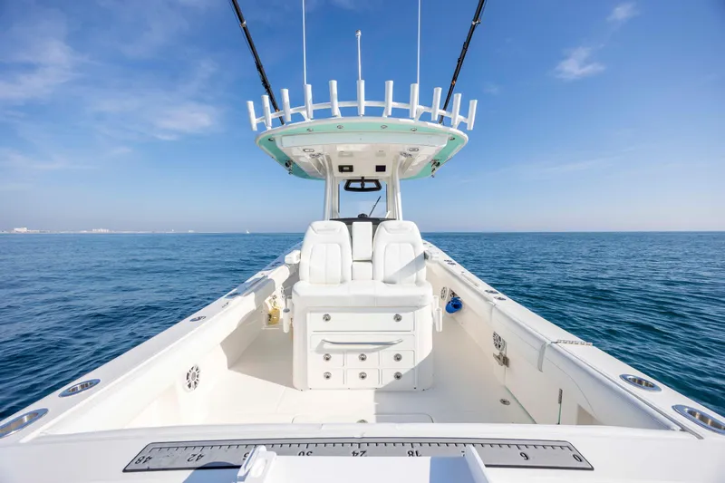  Yacht Photos Pics 2022 Regulator 31 boat on open sea under clear blue sky.