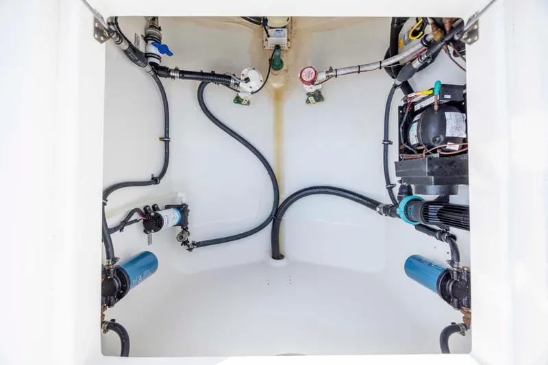  Yacht Photos Pics 2022 Regulator 31 boat compartment with visible wiring and components.