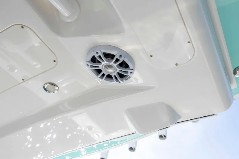  Yacht Photos Pics 2022 Regulator 31 boat detail showing speaker and sleek white finish.