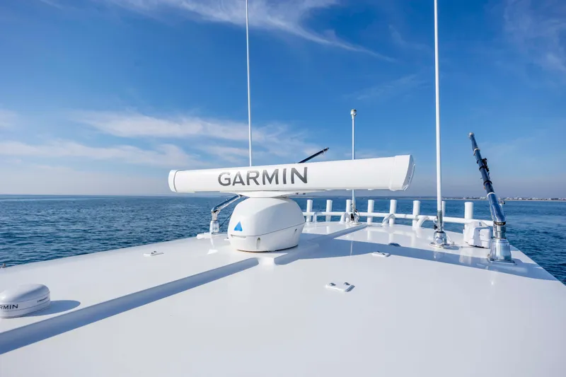  Yacht Photos Pics 2022 Regulator 31 boat with Garmin radar on open sea.