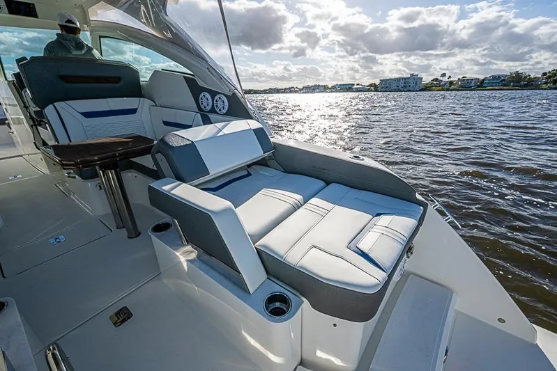 Prawn Star Yacht Photos Pics 2022 Tiara Yachts 34 LX interior with luxurious seating on a sunny day.