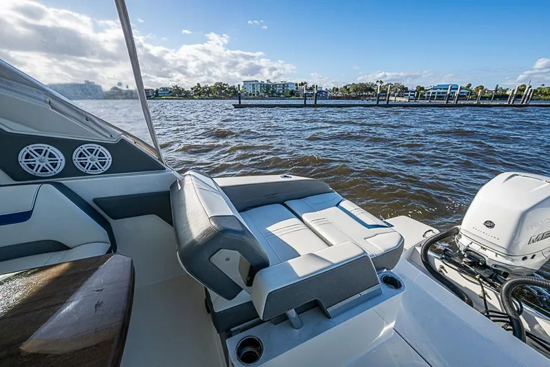 Prawn Star Yacht Photos Pics 2022 Tiara Yachts 34 LX boat interior with seating and water view.