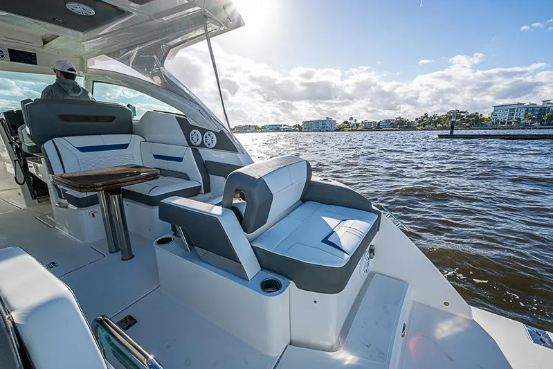 Prawn Star Yacht Photos Pics 2022 Tiara Yachts 34 LX on water, featuring luxurious seating and scenic view.