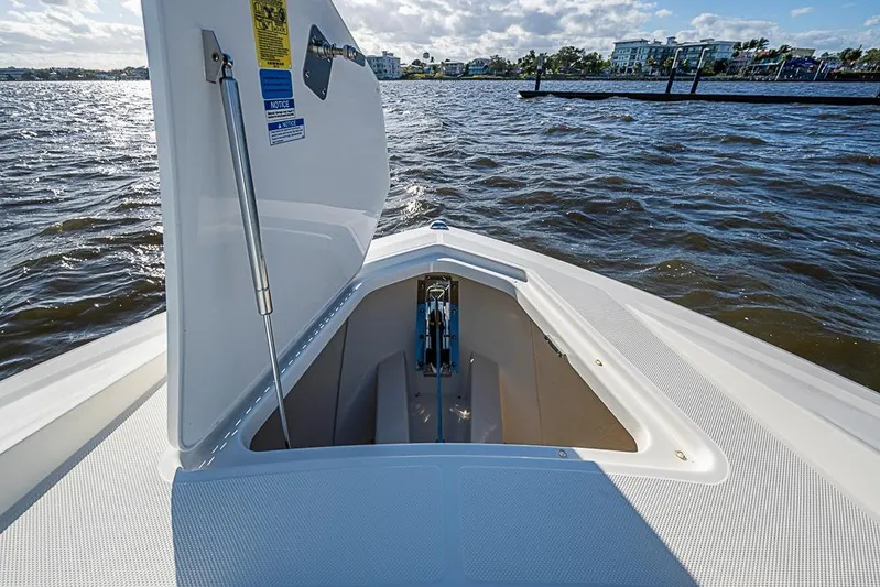 Prawn Star Yacht Photos Pics 2022 Tiara Yachts 34 LX bow storage compartment open on a sunny day.