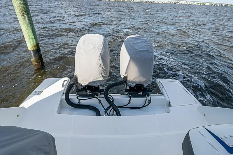 Prawn Star Yacht Photos Pics 2022 Tiara Yachts 34 LX with covered dual outboard motors on water.