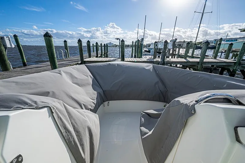 Prawn Star Yacht Photos Pics 2022 Tiara Yachts 34 LX boat docked, covered seating area, sunny day, waterfront view.