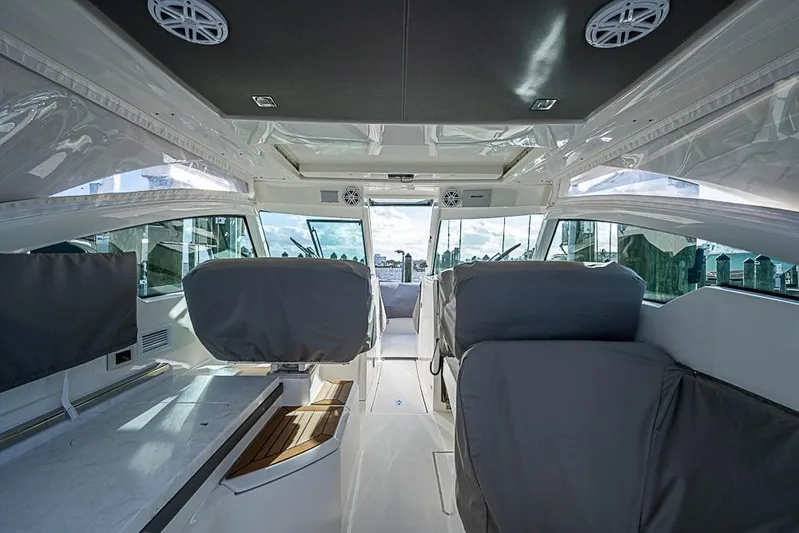 Prawn Star Yacht Photos Pics Interior of 2022 Tiara Yachts 34 LX, featuring modern seating and sleek design.