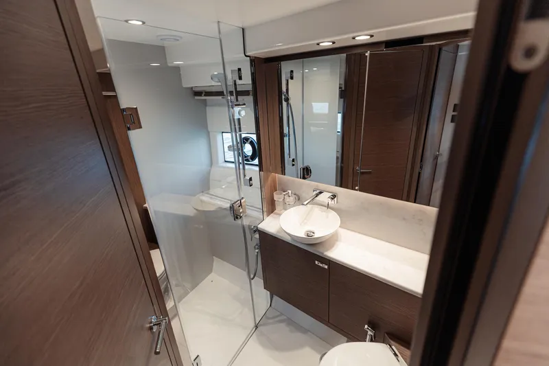  Yacht Photos Pics Luxurious bathroom in 2023 Princess F50 yacht with modern fixtures and elegant design.