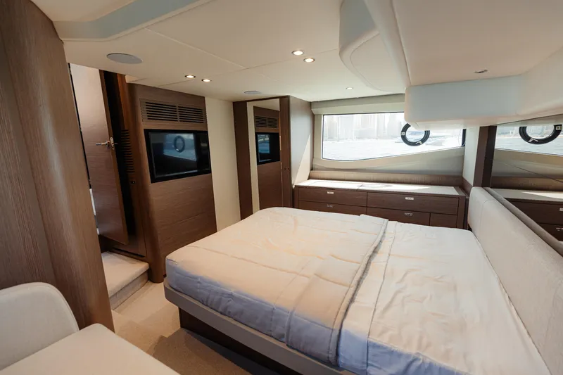  Yacht Photos Pics Luxurious interior of 2023 Princess F50 yacht with elegant bedroom design.