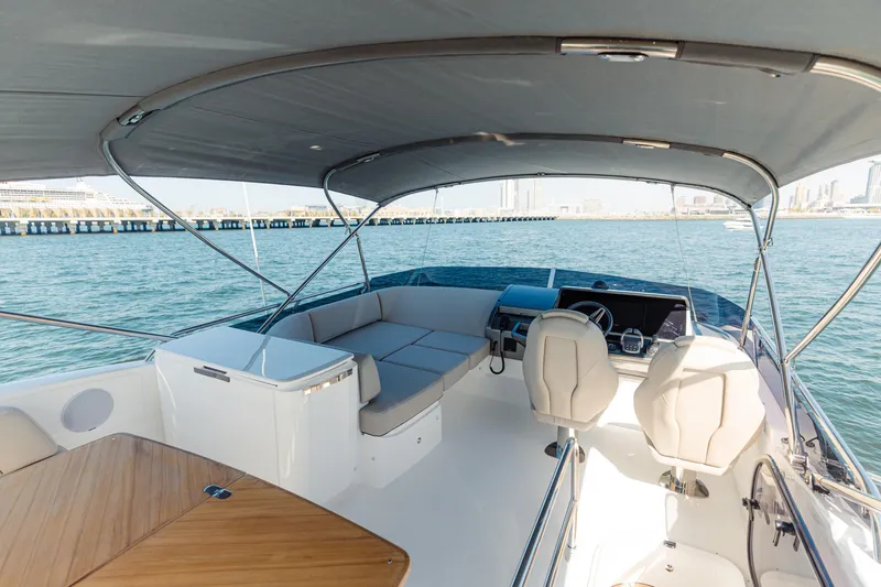  Yacht Photos Pics Luxurious 2023 Princess F50 yacht interior with seating, helm, and ocean view.