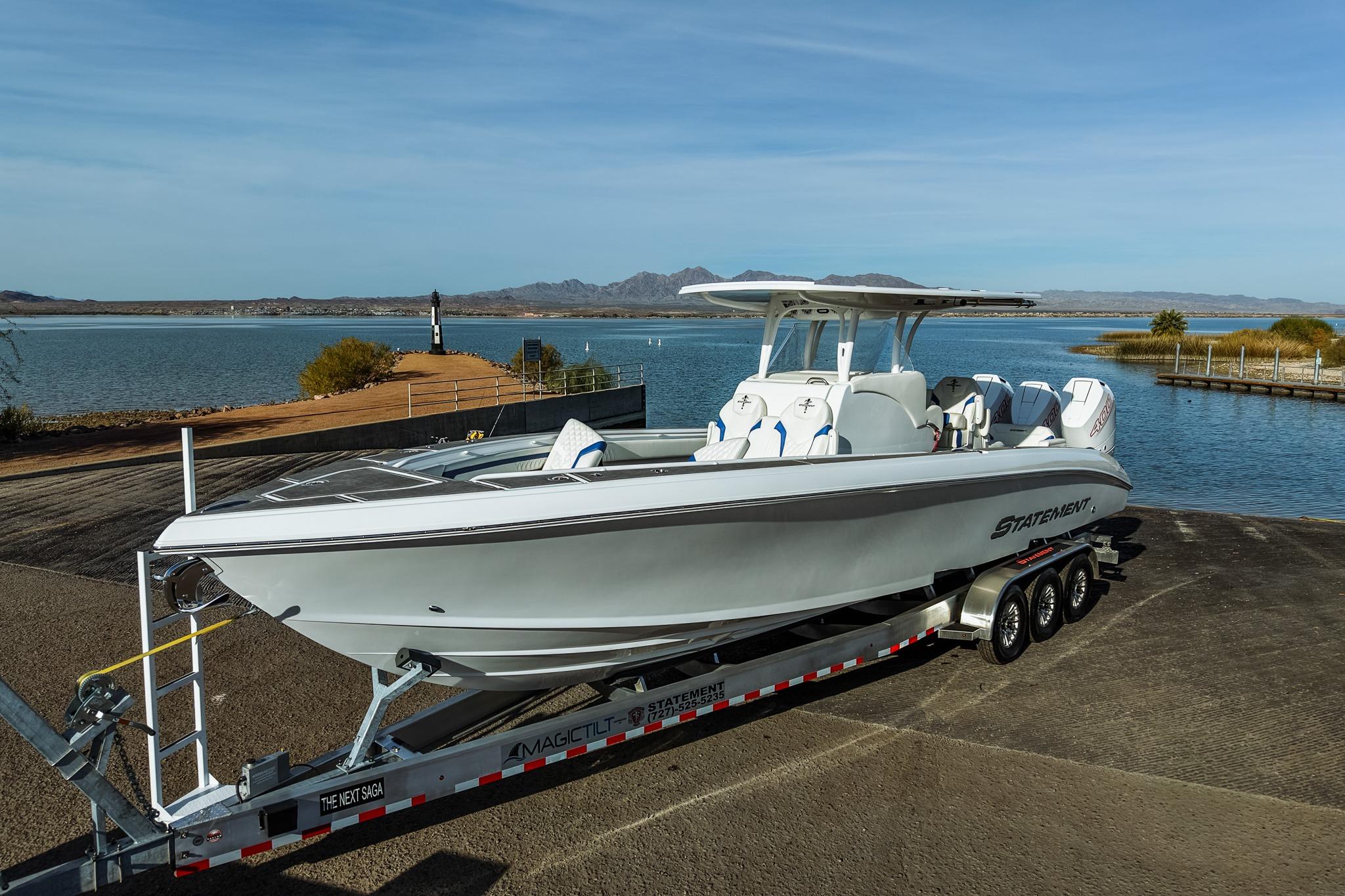 2026 Statement 350 Open boat on trailer by scenic lake backdrop.