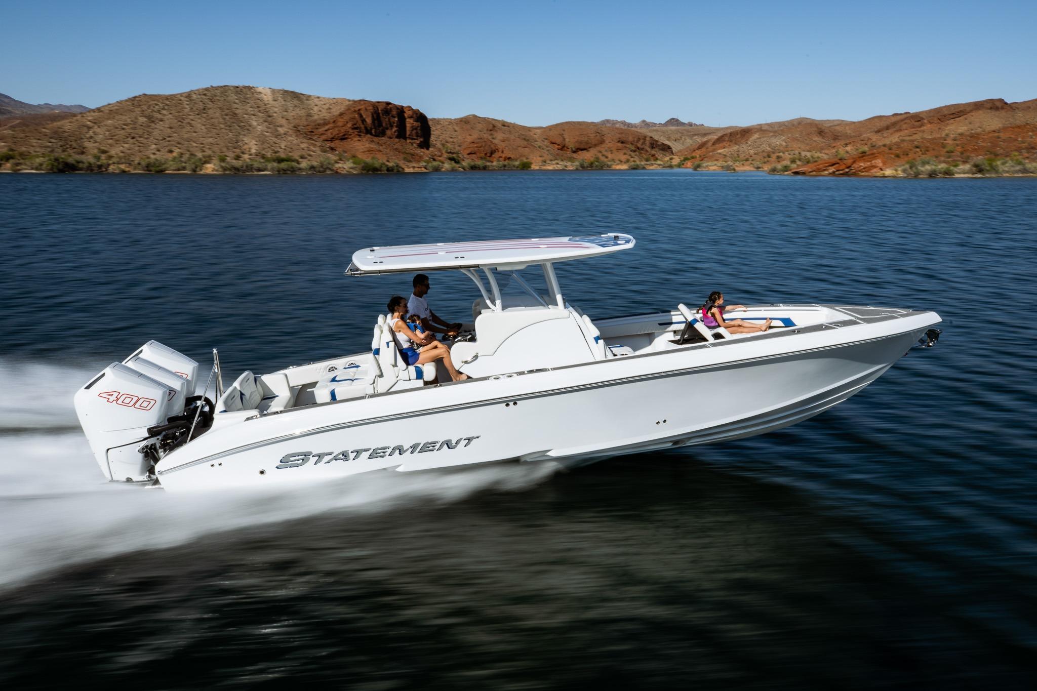 2026 Statement 350 Open boat cruising on a scenic lake with passengers onboard.