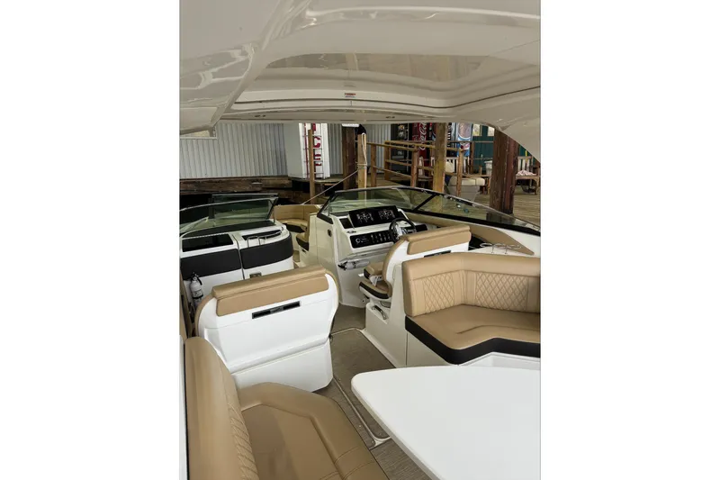  Yacht Photos Pics 2019 Sea Ray SLX 310 Outboard interior with luxurious seating and modern dashboard.